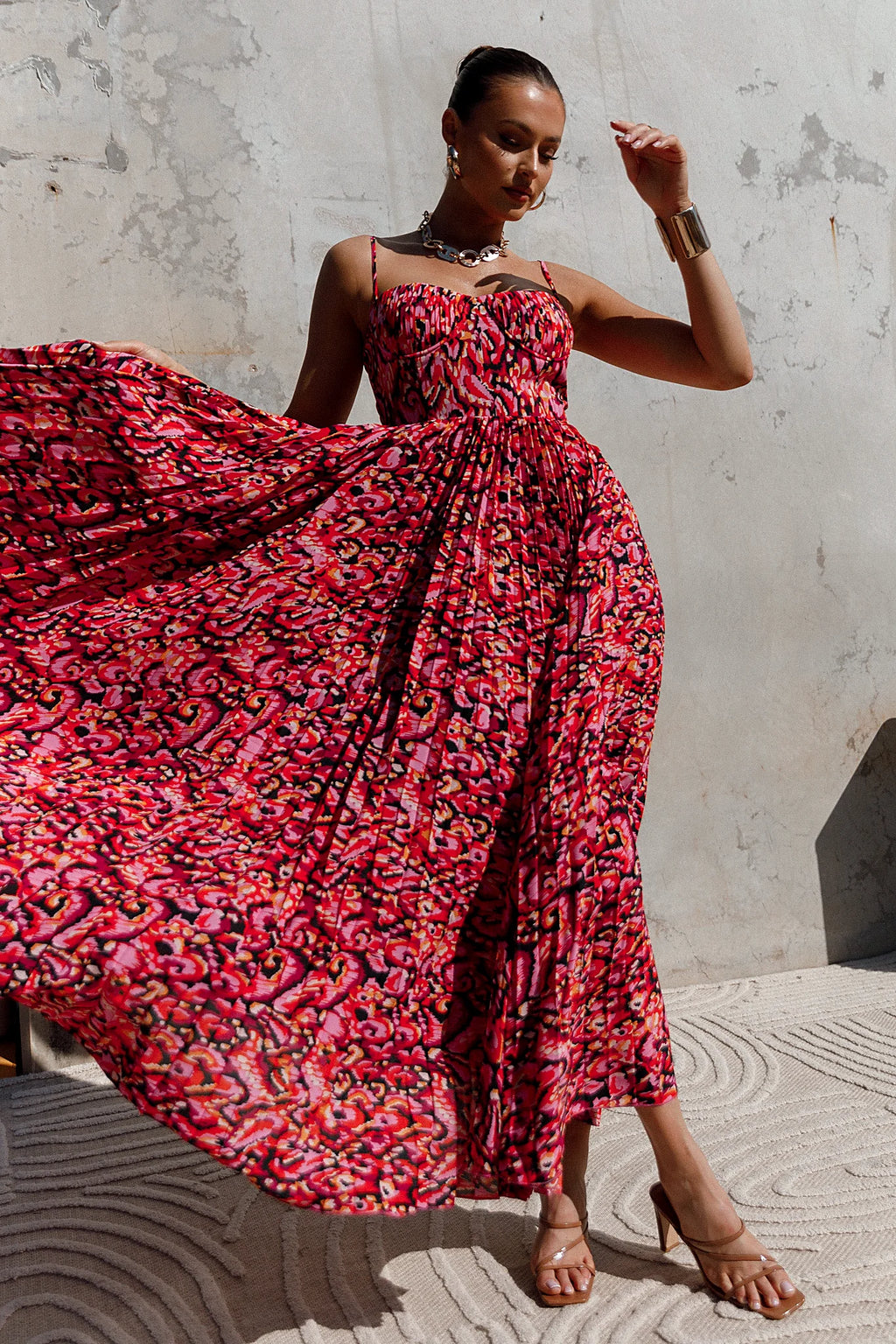 Front view of a pink pink multi pleated maxi dress, showing the neckline and bodice detail