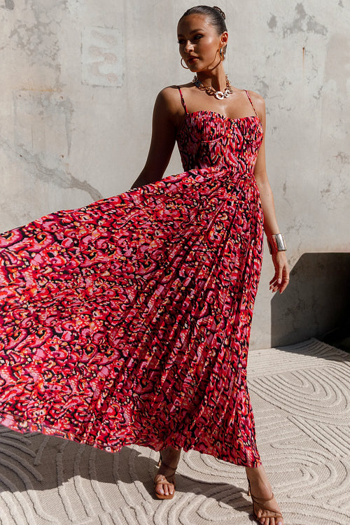 Back view of a pink pink multi pleated maxi dress, showing the fabric and hem finish