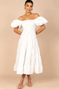 Front view of a white white smocked puff sleeve midi dress, showing the fabric and hem finish