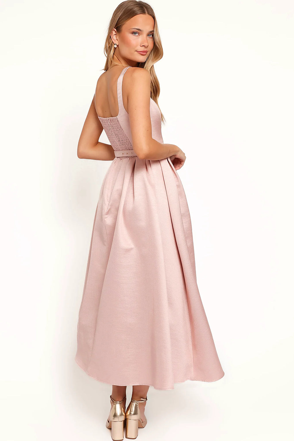 Close-up detail of a pink dusty pink midi dress, tulle underlay, showing the fit and drape of the skirt