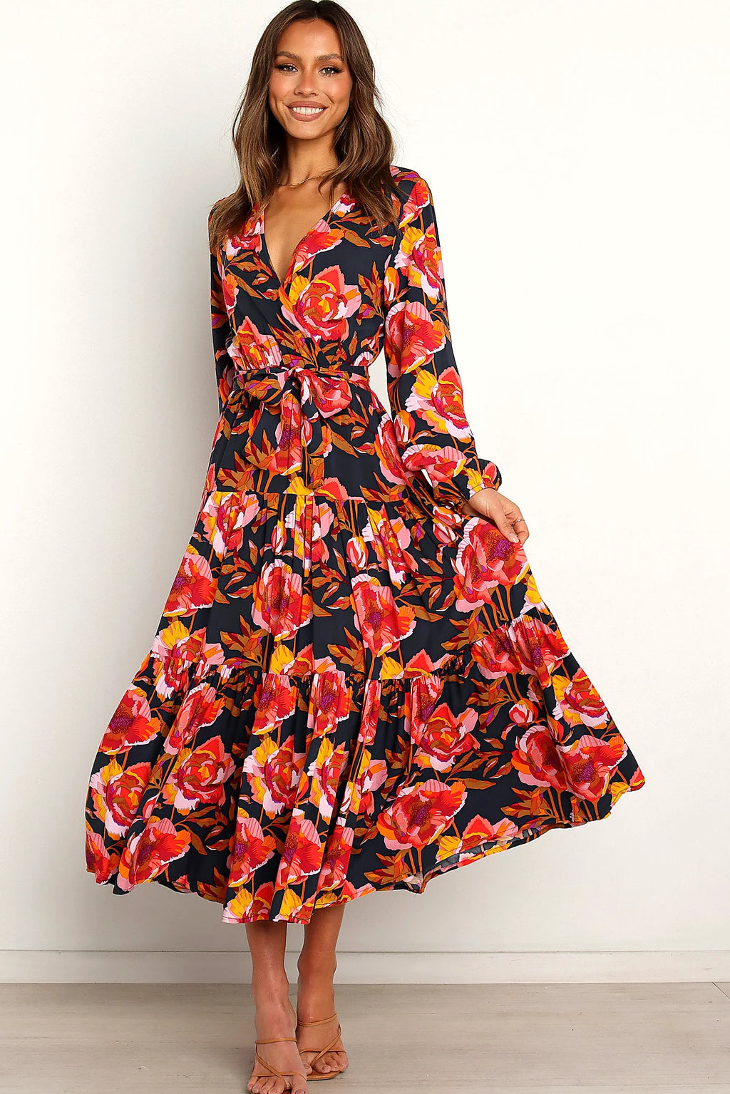 Back view of a navy navy floral tiered overlay maxi dress, showing the neckline and bodice detail