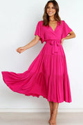 Front view of a pink pink ruffle sleeve tiered midi dress, showing the neckline and bodice detail