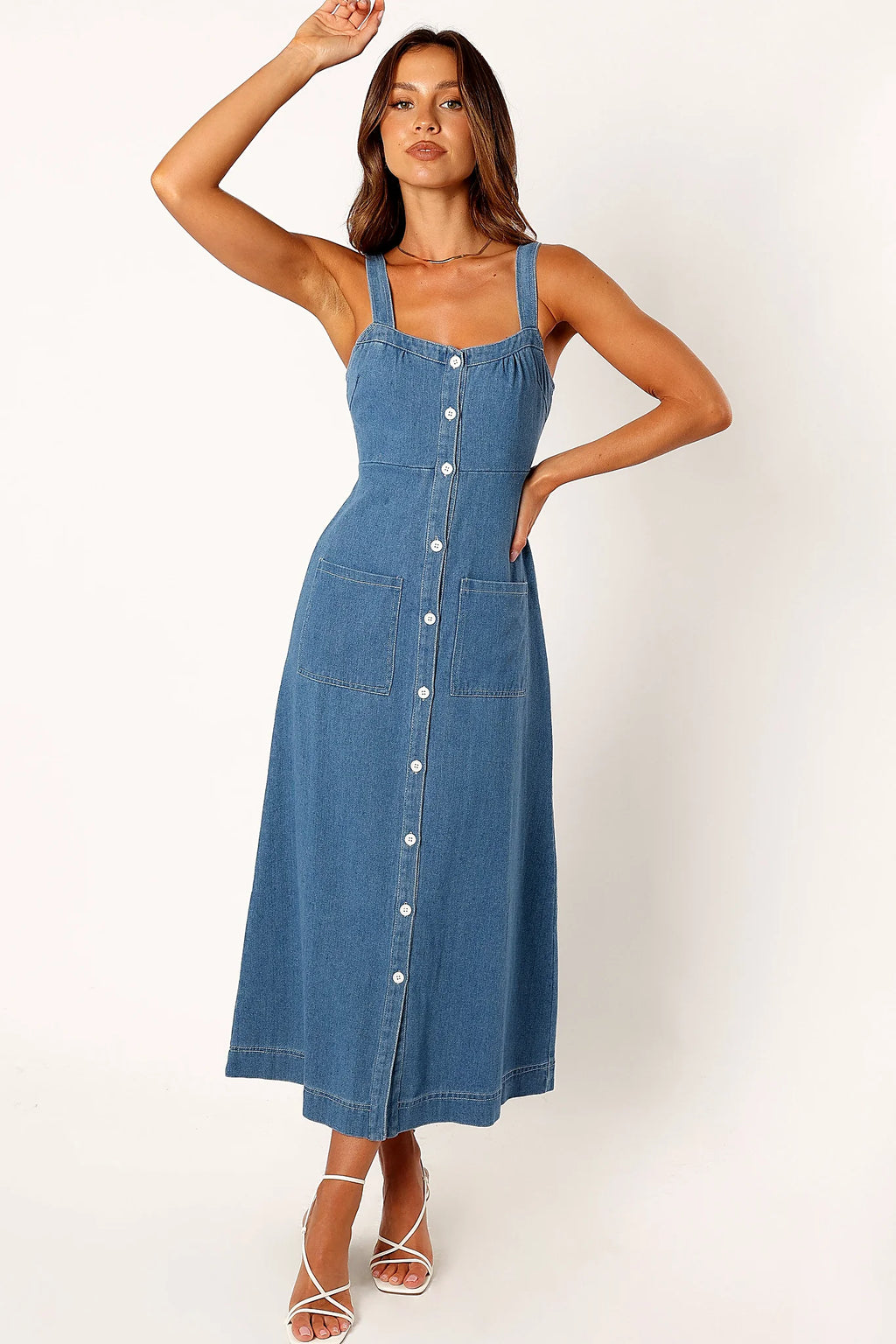 Back view of a denim midi dress, showing the neckline and bodice detail