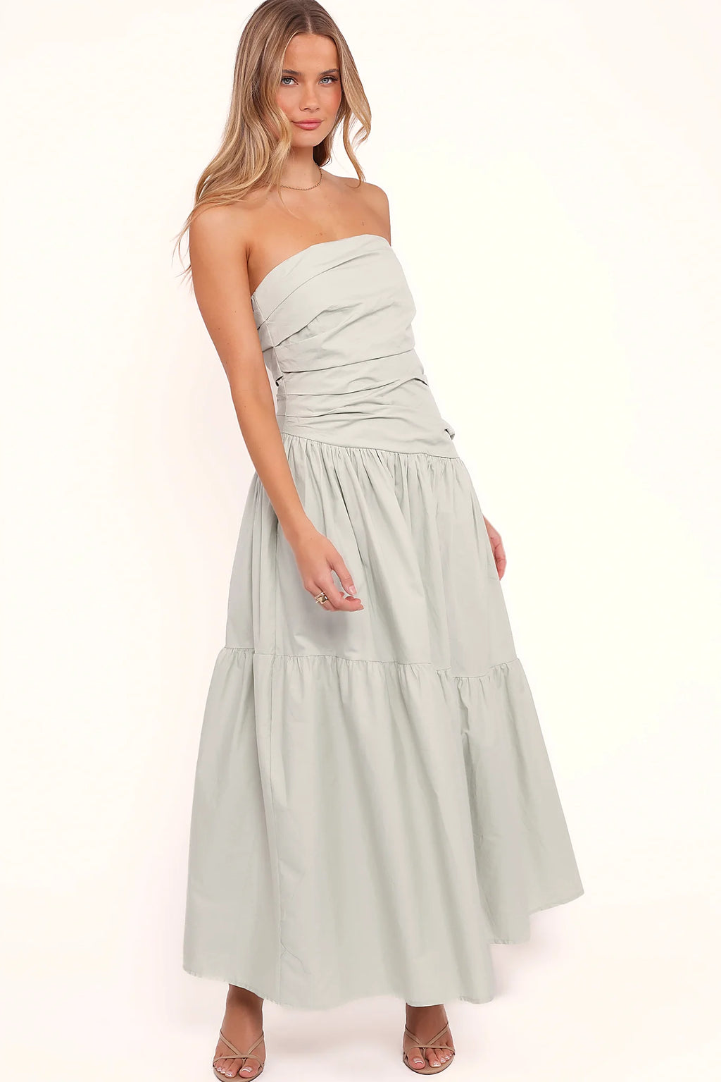Back view of a mint strapless maxi dress, tiered skirt, showing the neckline and bodice detail