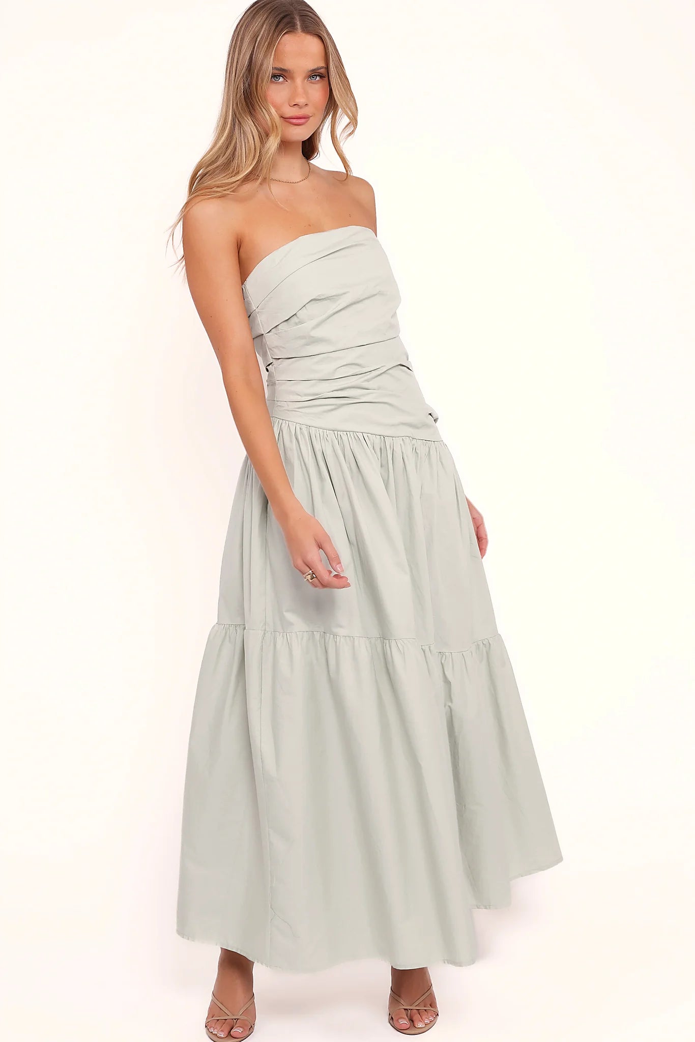 Back view of a mint strapless maxi dress, tiered skirt, showing the neckline and bodice detail