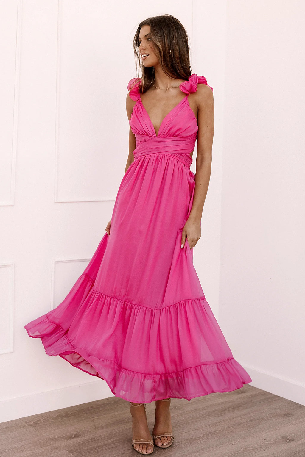 Back view of a up back berry midi dress, lace, worn by a model against a plain studio backdrop