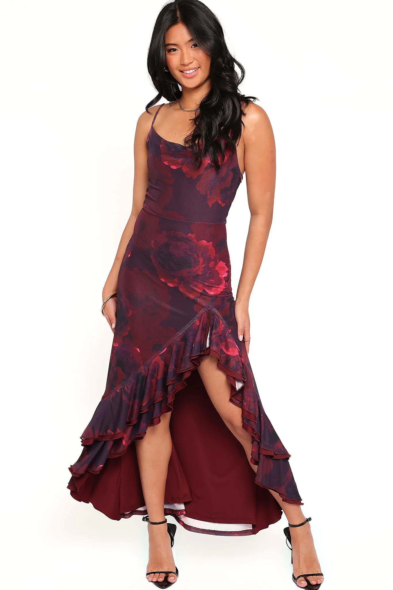 Back view of a red red floral maxi dress, ruffle split, showing the fit and drape of the skirt