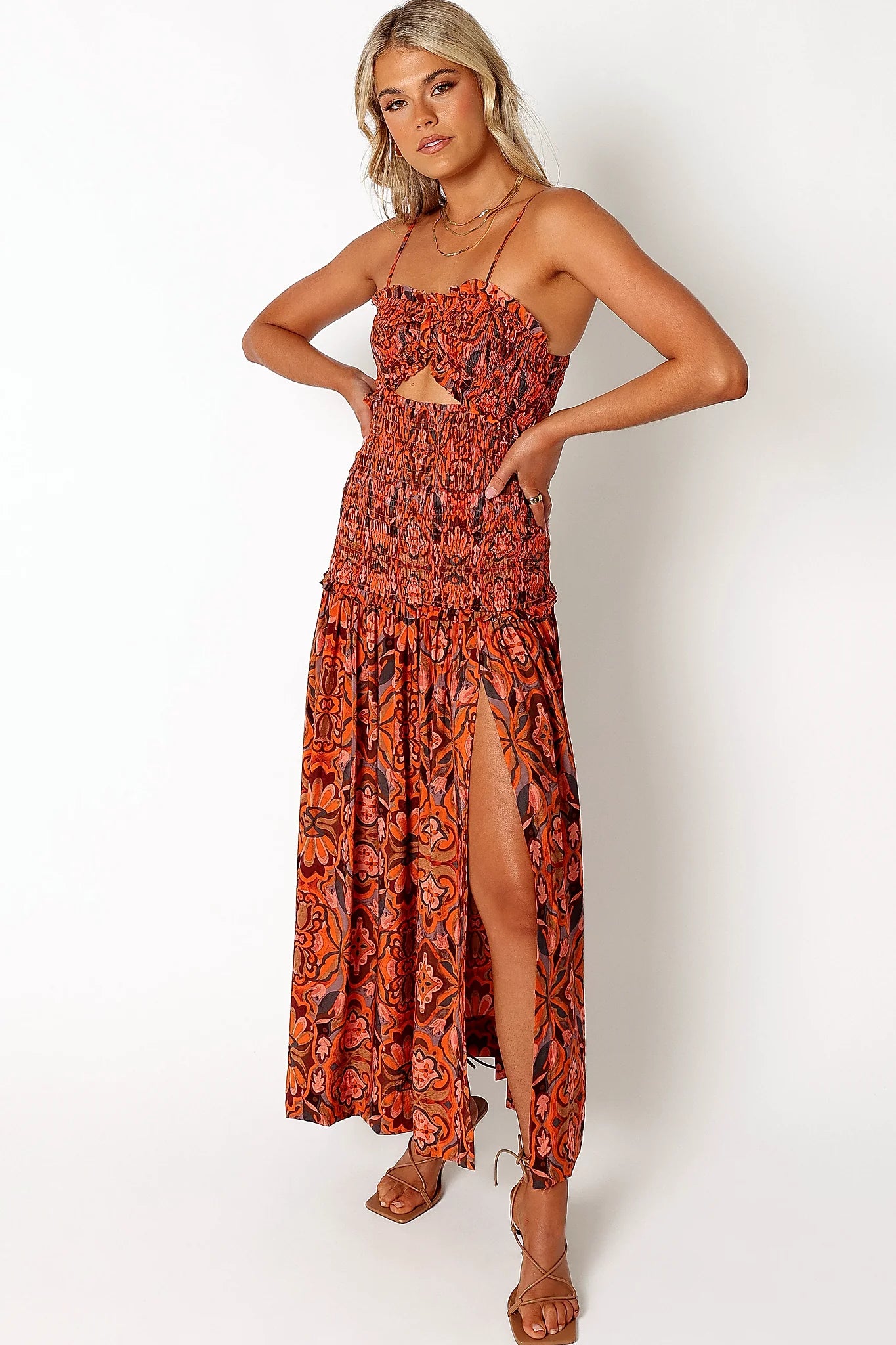 Front view of a harvest moon floral midi dress, showing the fabric and hem finish