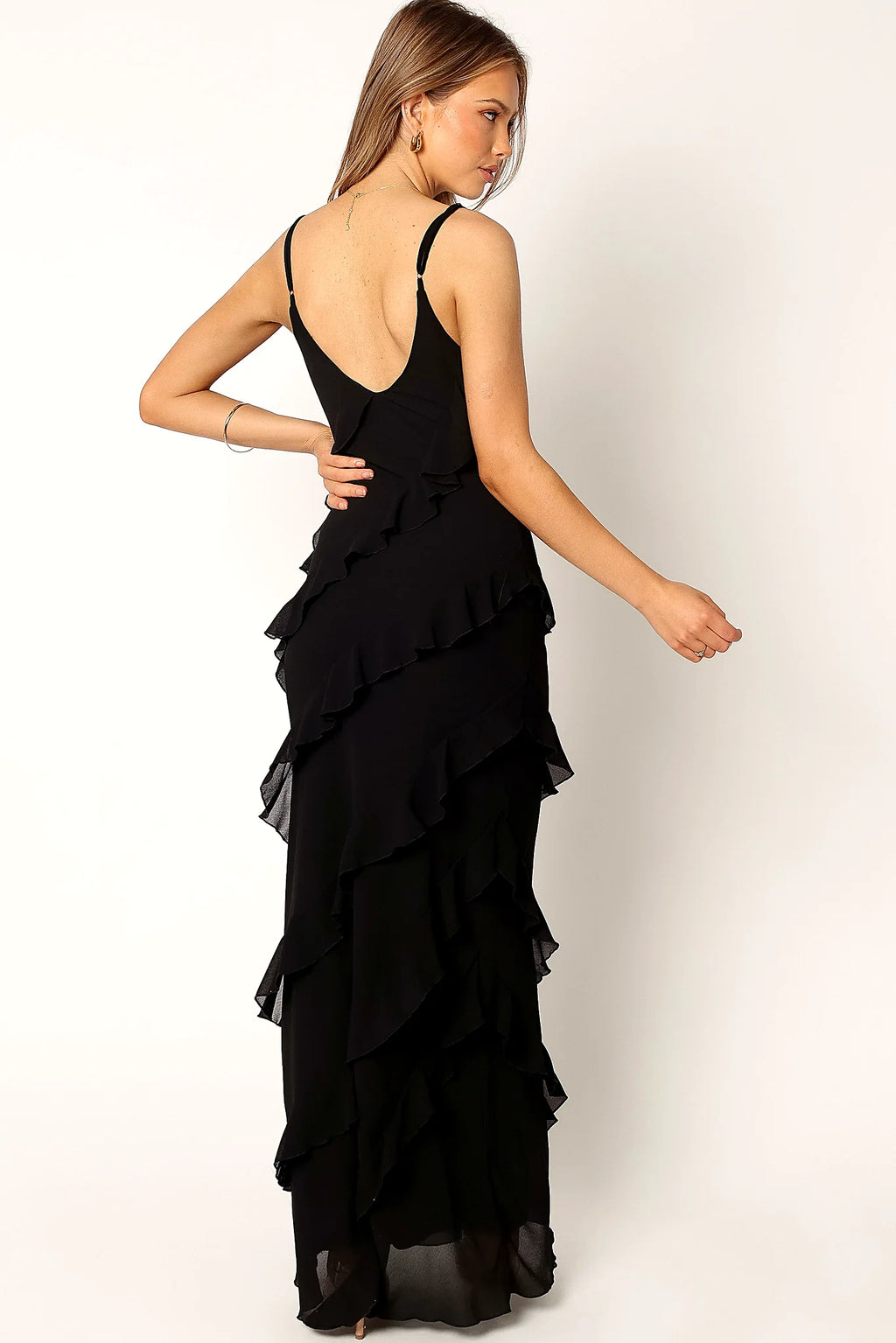 Side view of a black black ruffle maxi dress, v back, showing the neckline and bodice detail