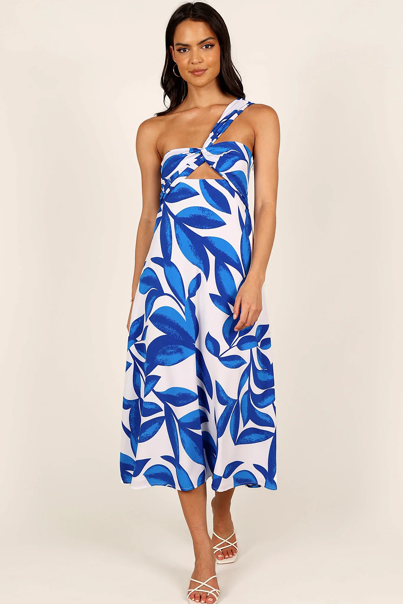 Back view of a white/blue midi dress, showing the fabric and hem finish
