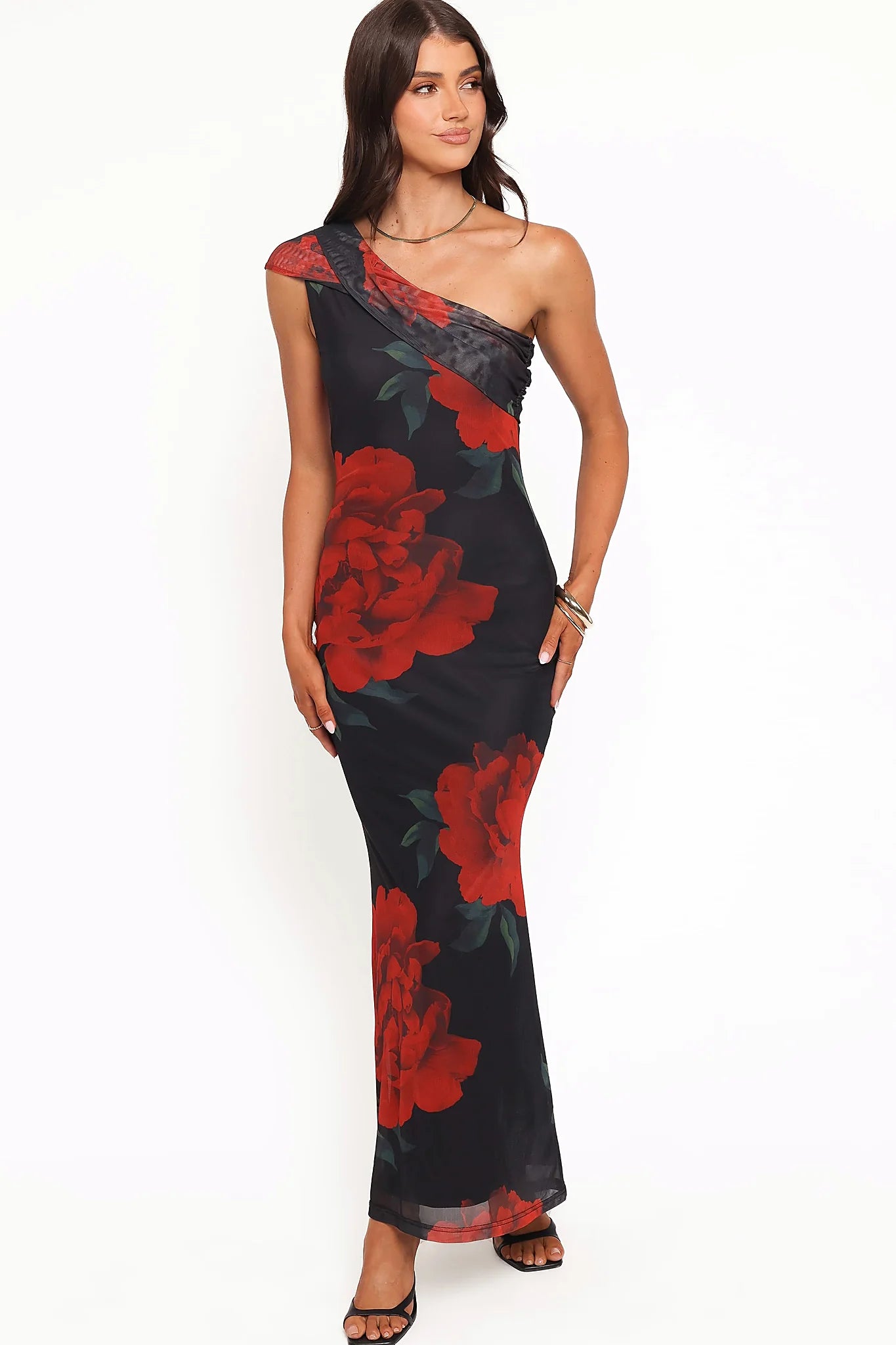 Back view of a black one shoulder black floral maxi dress, showing the neckline and bodice detail
