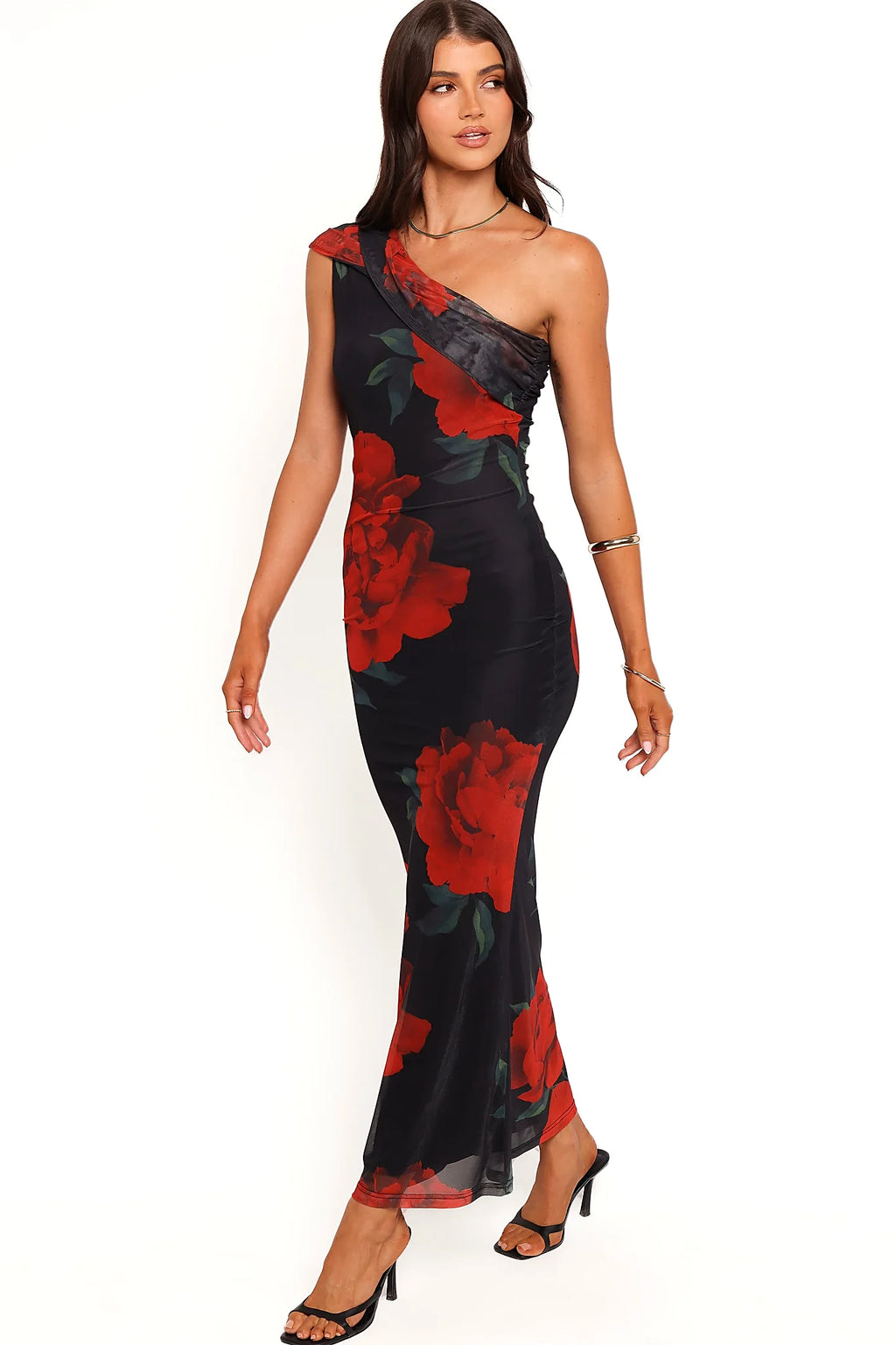 Asymmetric neckline crossing a single shoulder in black floral