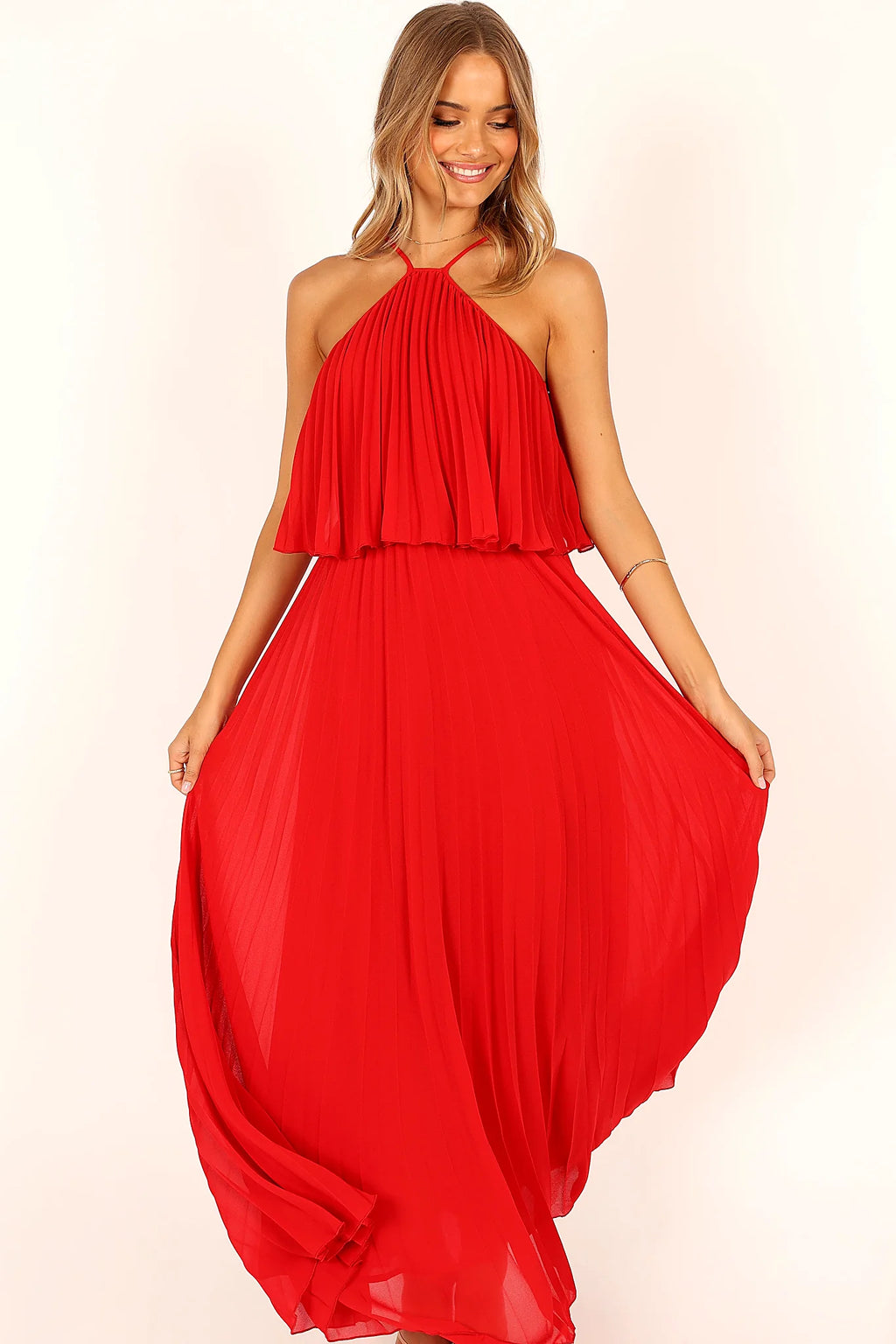 Open back closing with a tie on a red halterneck gown