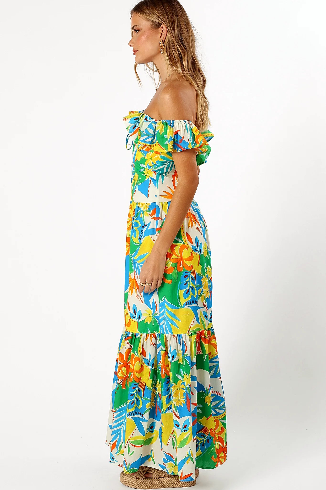 Close-up detail of a malta print maxi dress, ruffle sleeves, showing the fit and drape of the skirt
