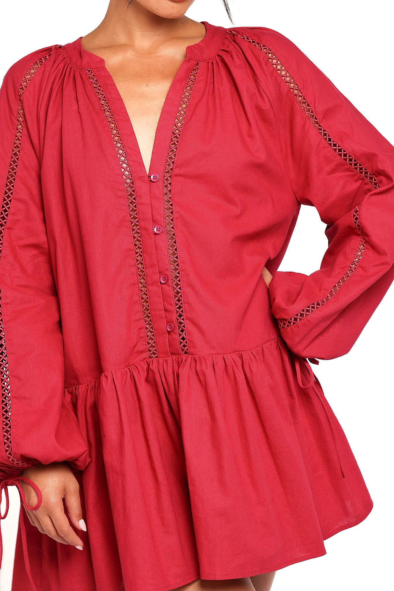 Front view of a red wine mini dress with long sleeves, showing the neckline and bodice detail