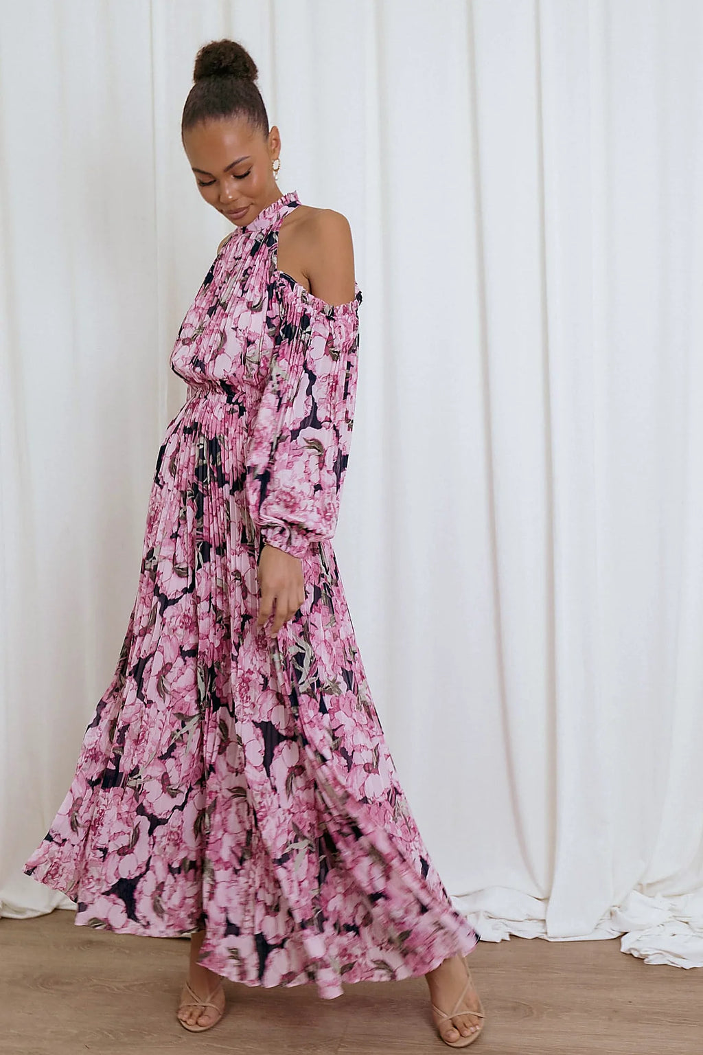 Front view of a pink pink floral pleated maxi dress, showing the fit and drape of the skirt