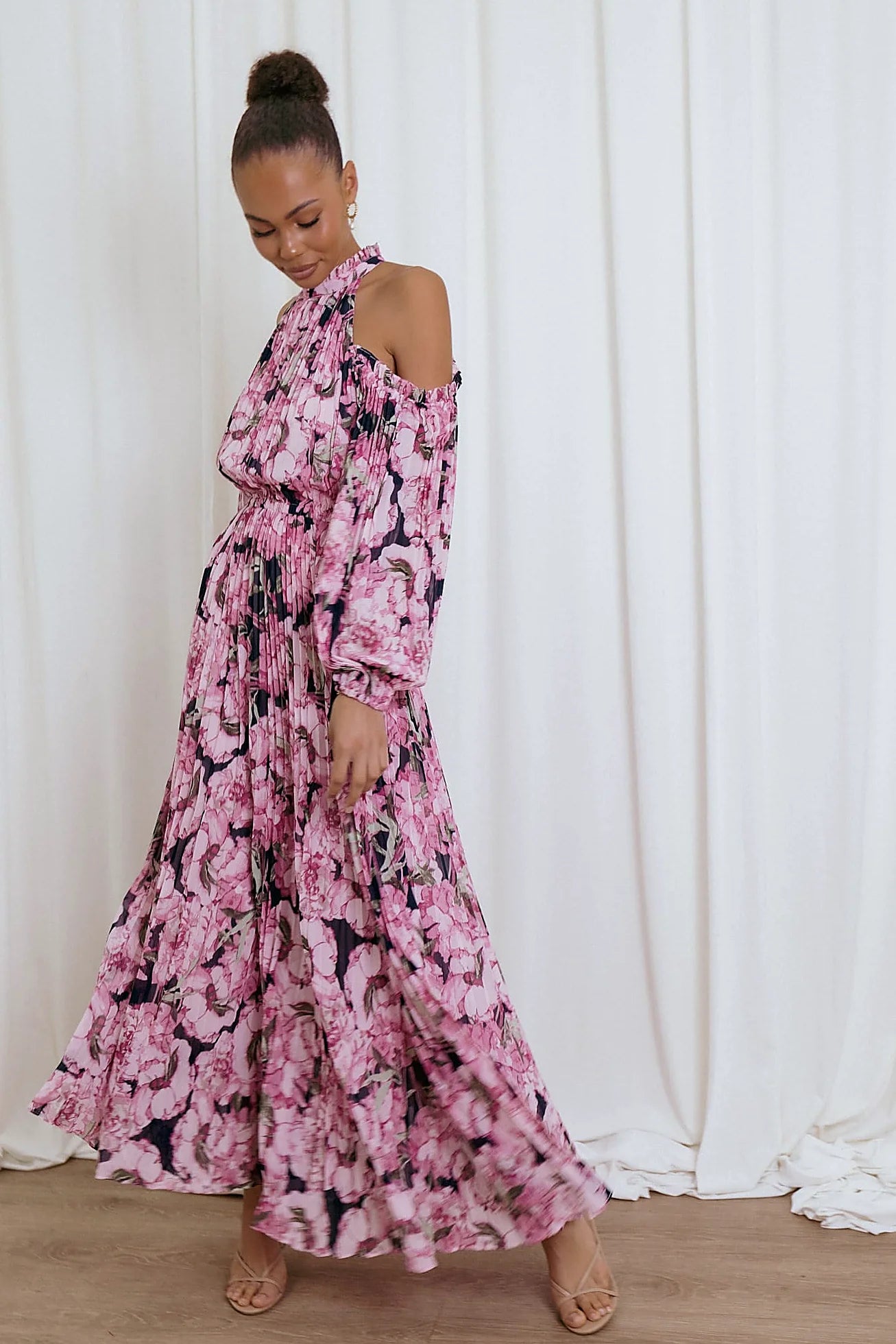 Front view of a pink pink floral pleated maxi dress, showing the fit and drape of the skirt