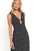 Front view of a black black floral maxi dress with lace trim, worn by a model against a plain studio backdrop