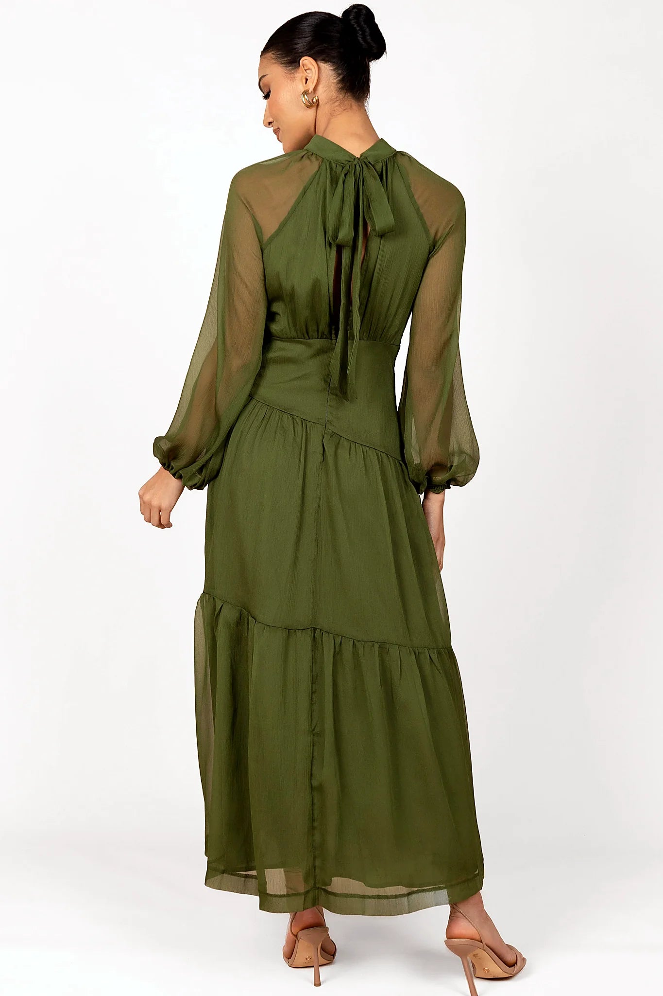 Front view of a olive maxi dress with sheer sleeves, showing the fabric and hem finish