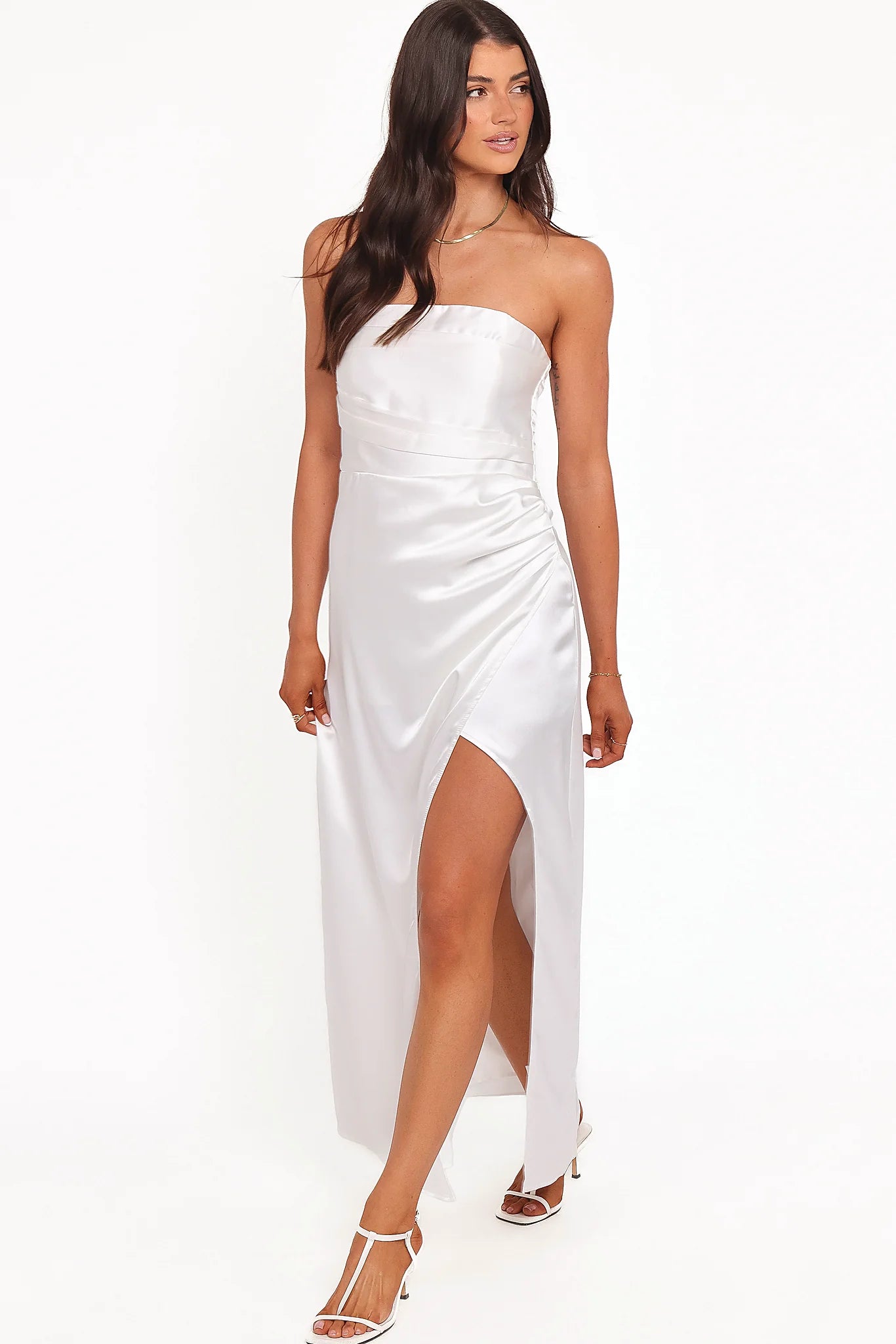 Front view of a white strapless maxi dress, showing the fit and drape of the skirt