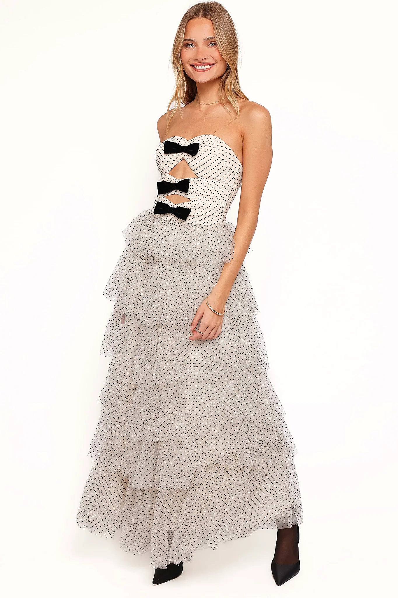 Drop tiered ruffle skirt on a cream strapless midi dress