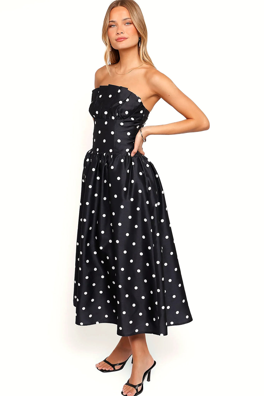 Close-up detail of a line polka dot strapless midi dress, a, showing the neckline and bodice detail