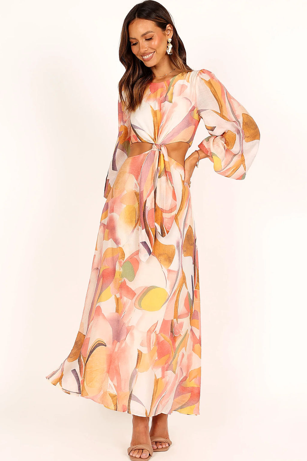 Front view of a pink pink abstract print maxi dress, showing the fabric and hem finish