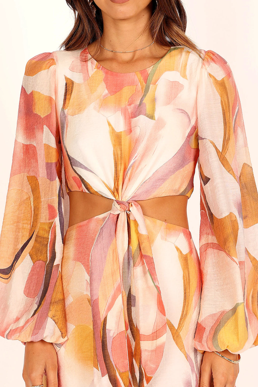 Side view of a pink pink abstract print maxi dress, showing the fit and drape of the skirt