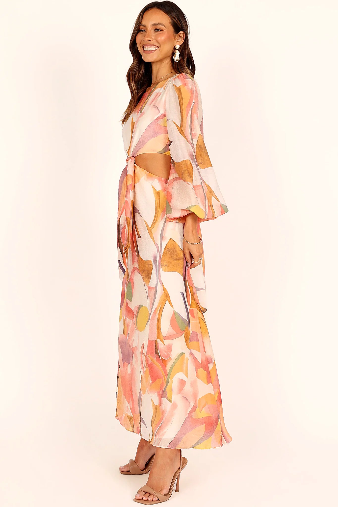 Close-up detail of a pink pink abstract print maxi dress, showing the neckline and bodice detail