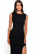 Black velvet maxi dress cut close to the body with a high neckline