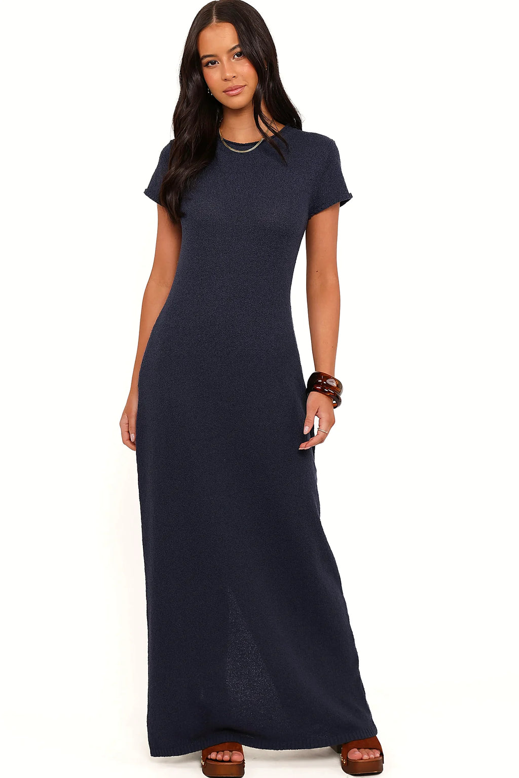 Back view of a navy navy knit maxi dress, rolled neckline, showing the neckline and bodice detail
