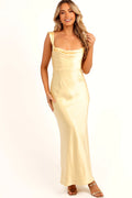 Lemon satin maxi dress with a cowl neckline draping at the front