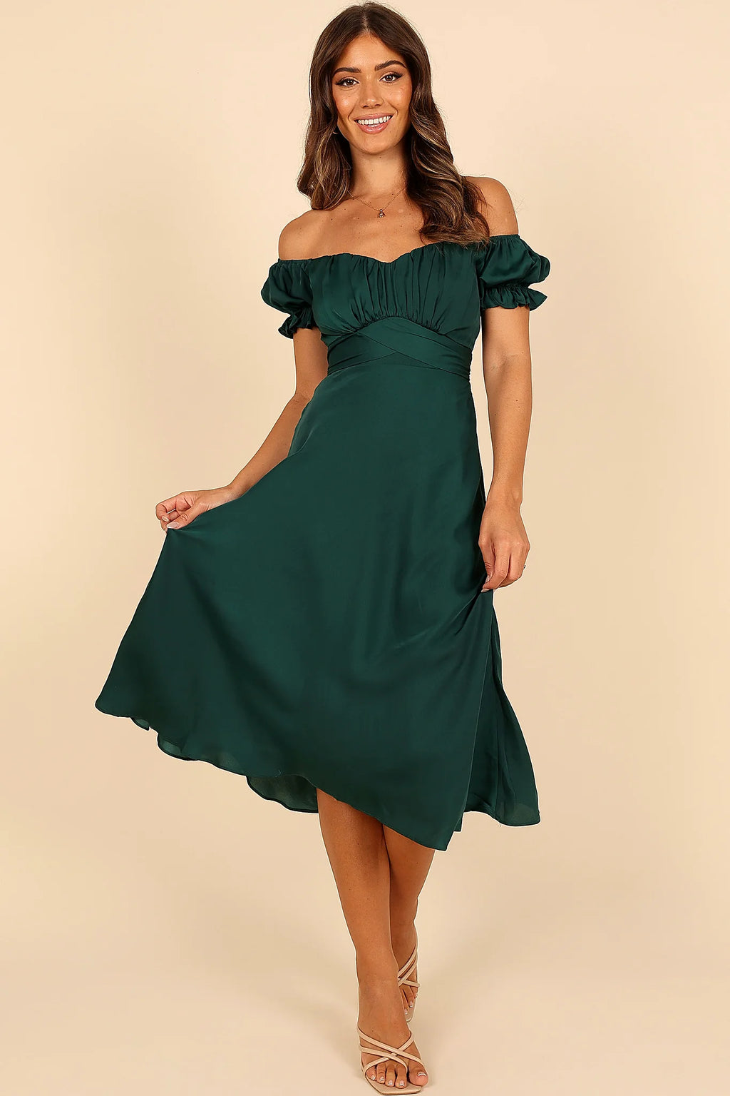 Back view of a green emerald off shoulder frill midi dress, showing the neckline and bodice detail