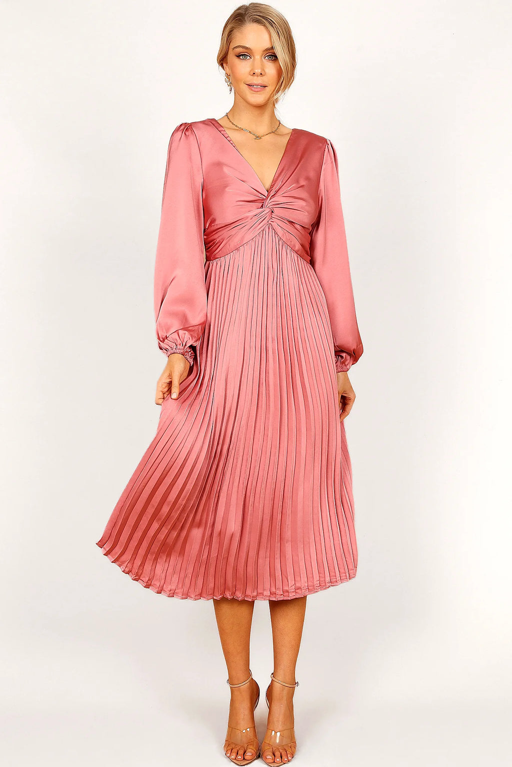 Long sleeves finishing in elasticised cuffs on a blush dress