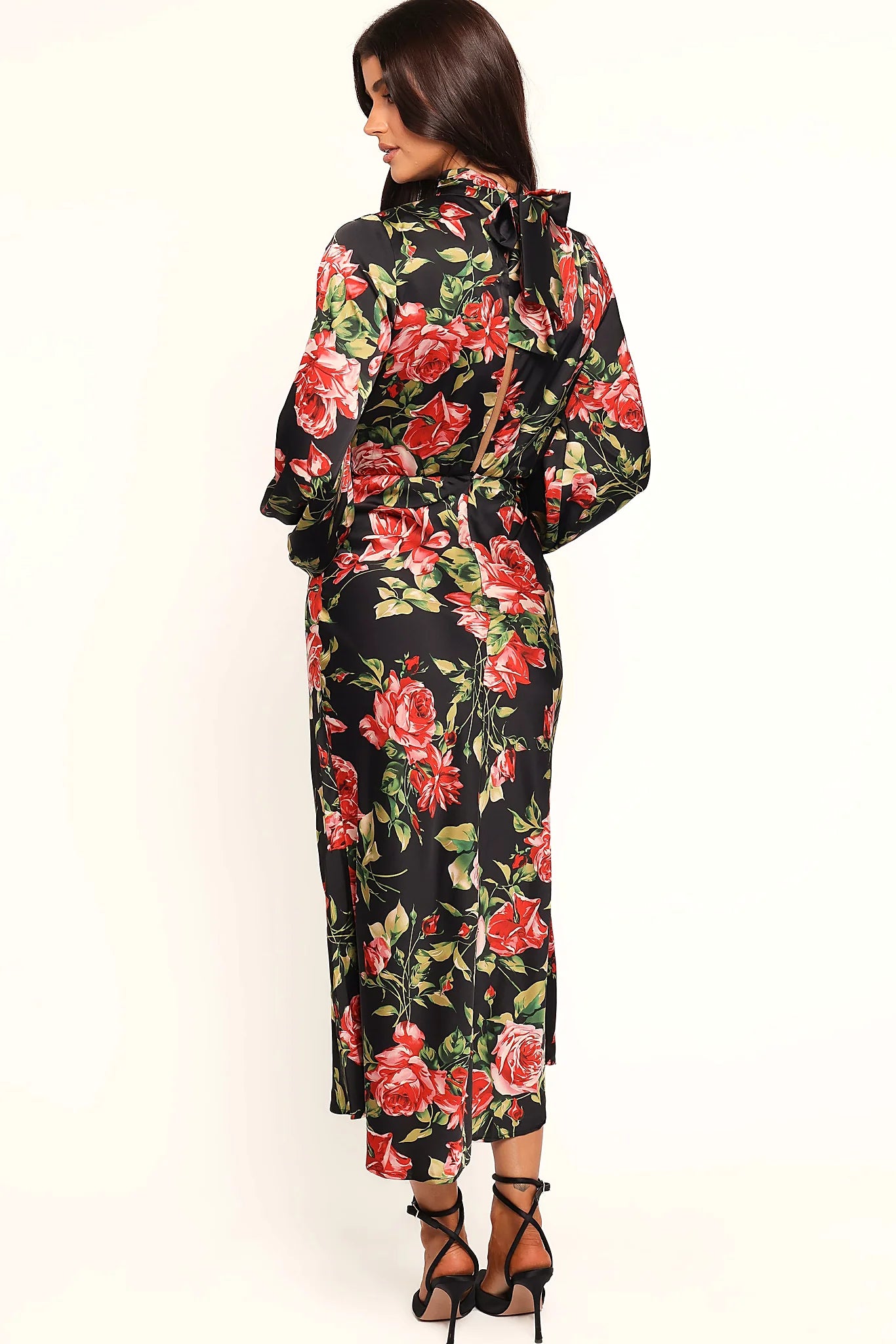 Close-up detail of a black black floral midi dress, open back, showing the neckline and bodice detail