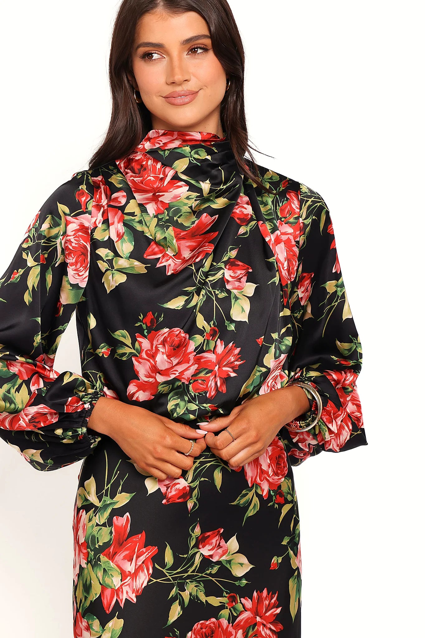 Front view of a black black floral midi dress, open back, showing the fabric and hem finish