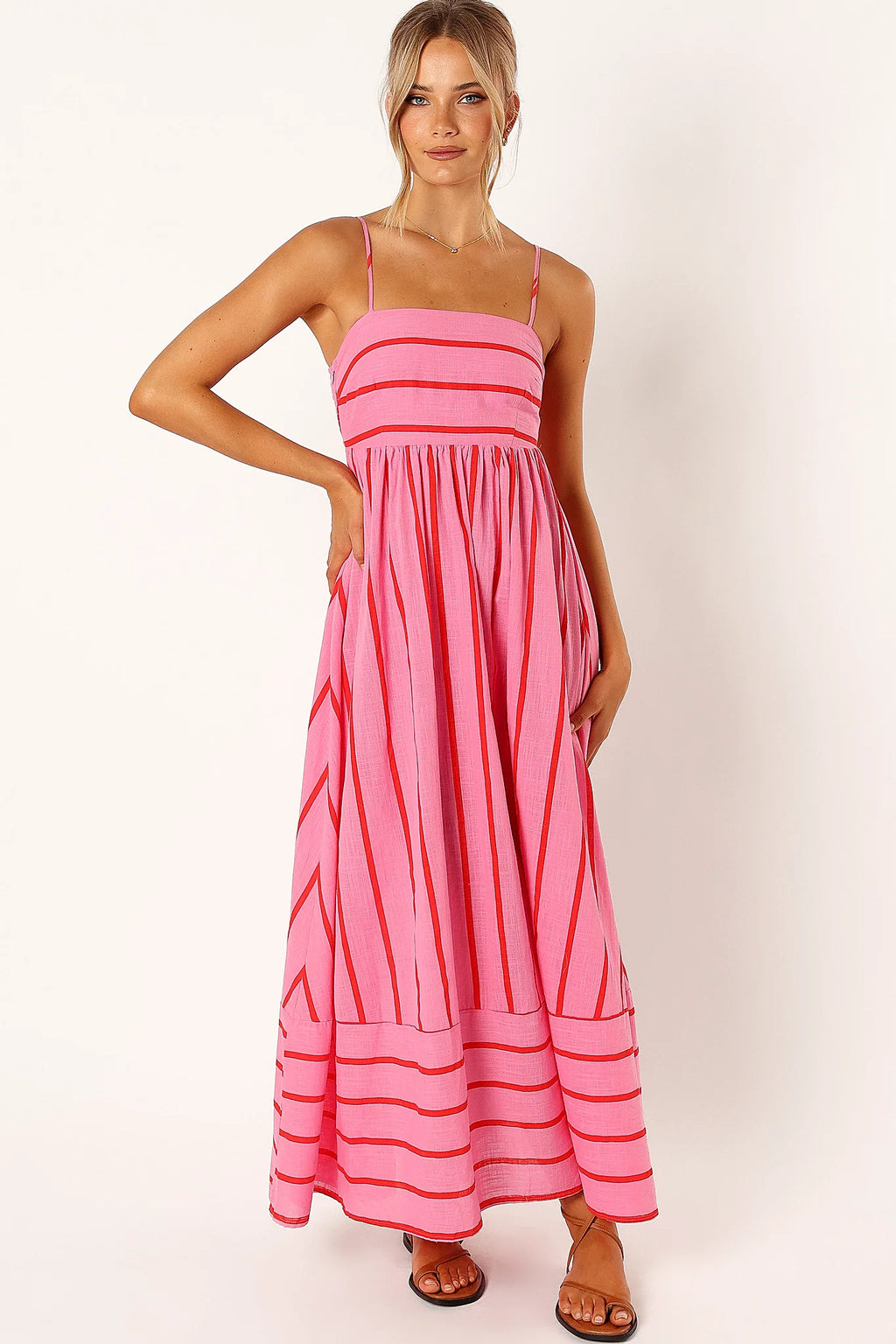 Front view of a pink pink & red stripe maxi dress, showing the fabric and hem finish