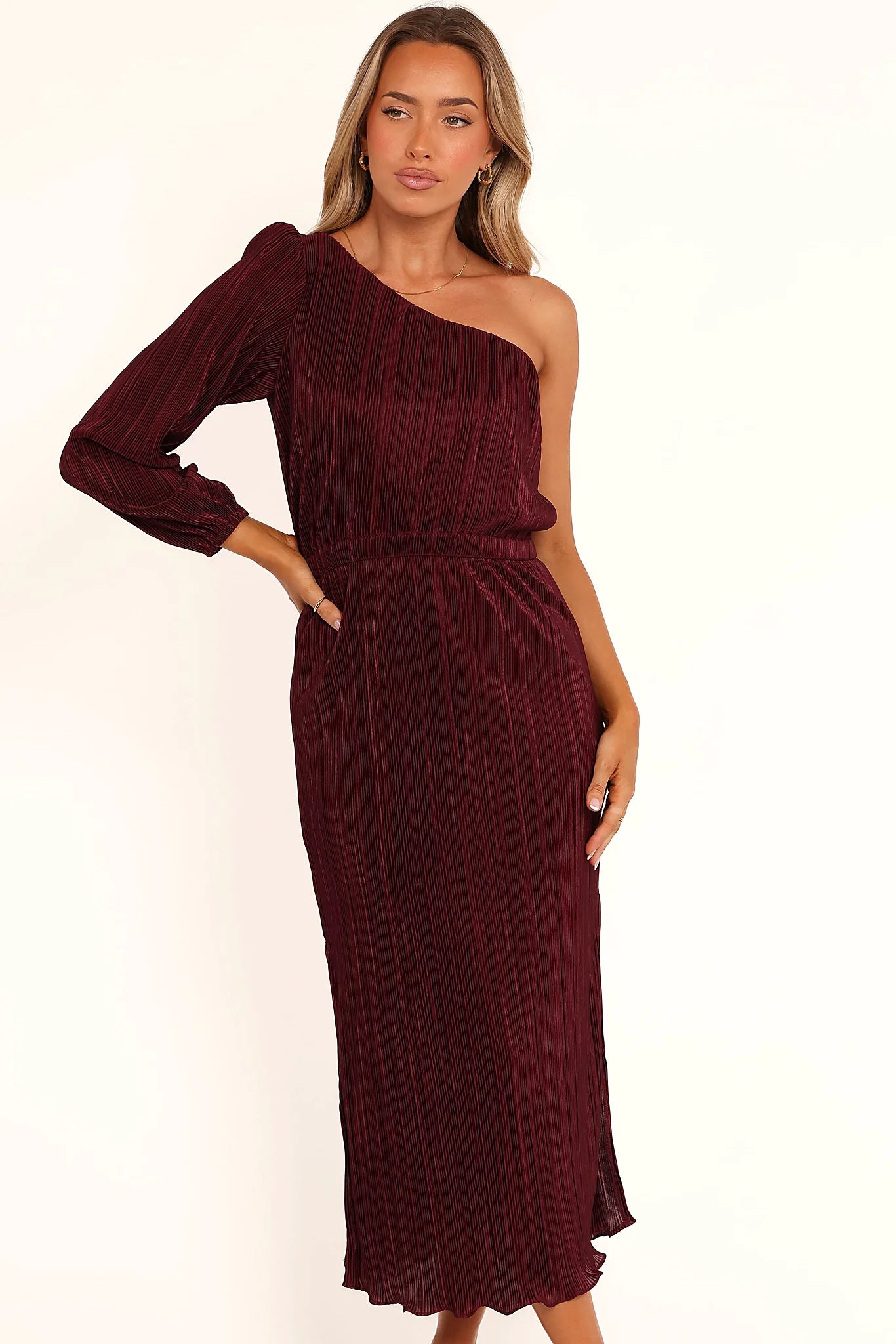 Front view of a red burgundy one shoulder pleated midi dress, showing the neckline and bodice detail