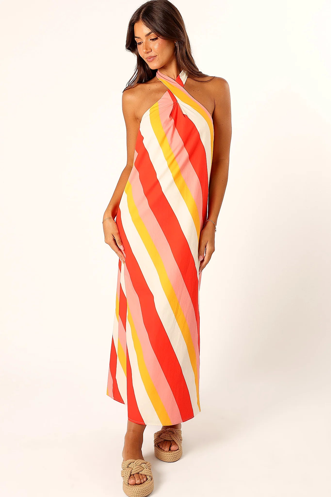 Side view of a pink stripe maxi dress, showing the fit and drape of the skirt