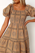 Front view of a black tan & black sun print midi dress, showing the fit and drape of the skirt