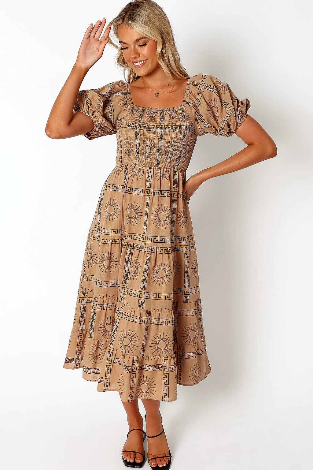 Back view of a black tan & black sun print midi dress, showing the neckline and bodice detail