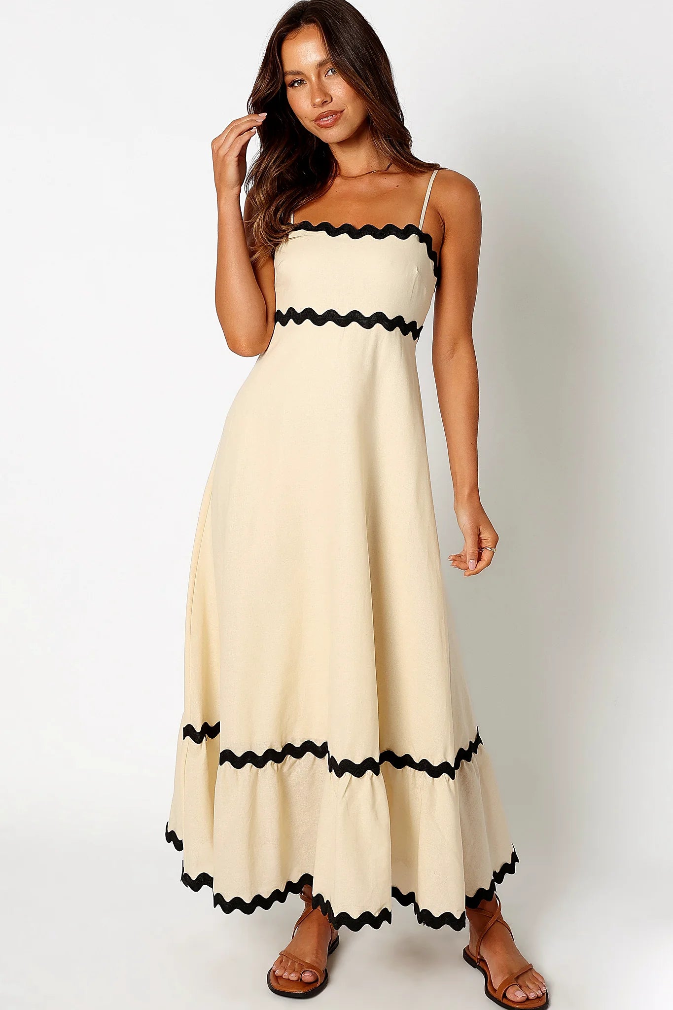 Back view of a black cream & black relaxed maxi dress, showing the fit and drape of the skirt