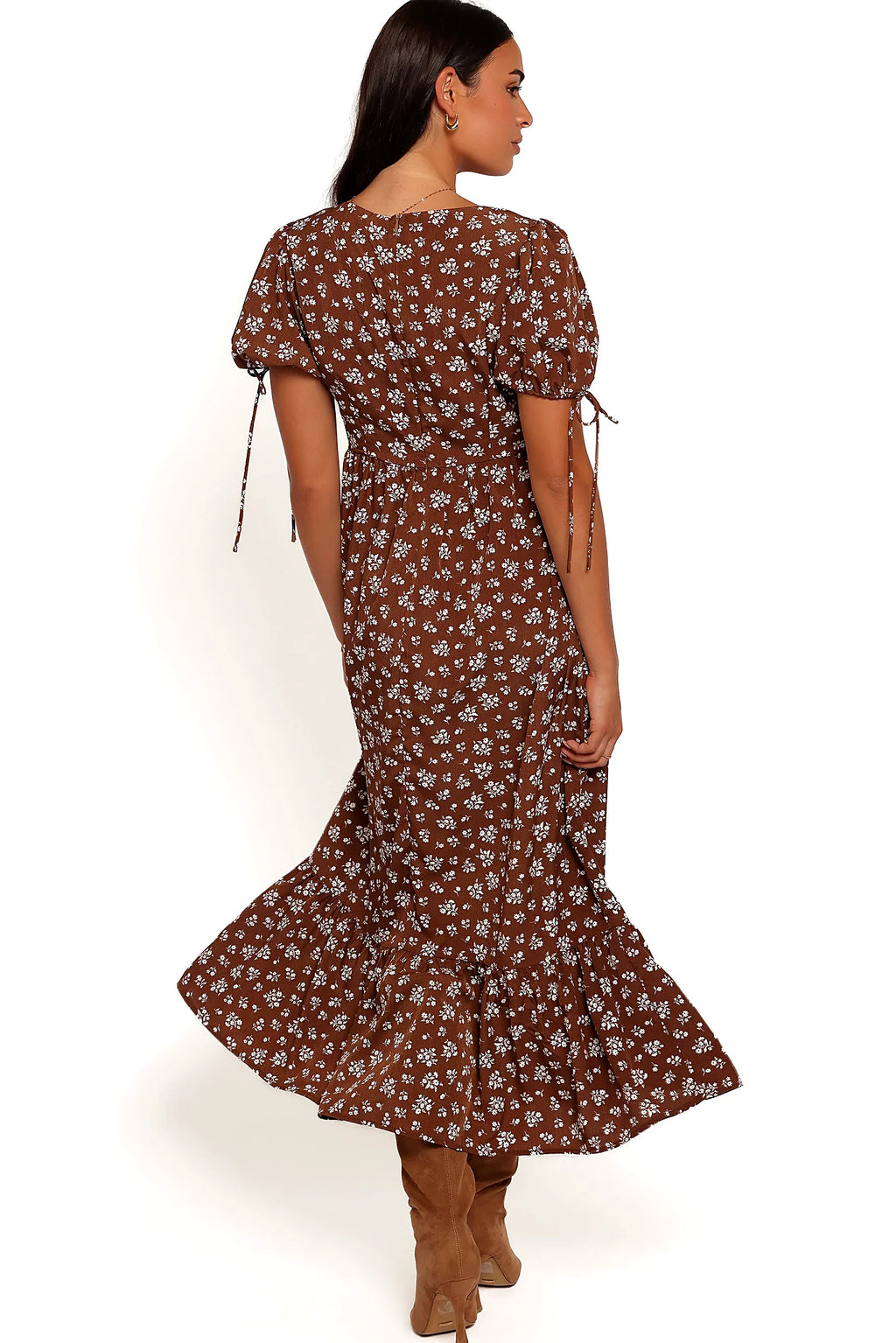 Close-up detail of a brown ditsy floral maxi dress, showing the neckline and bodice detail