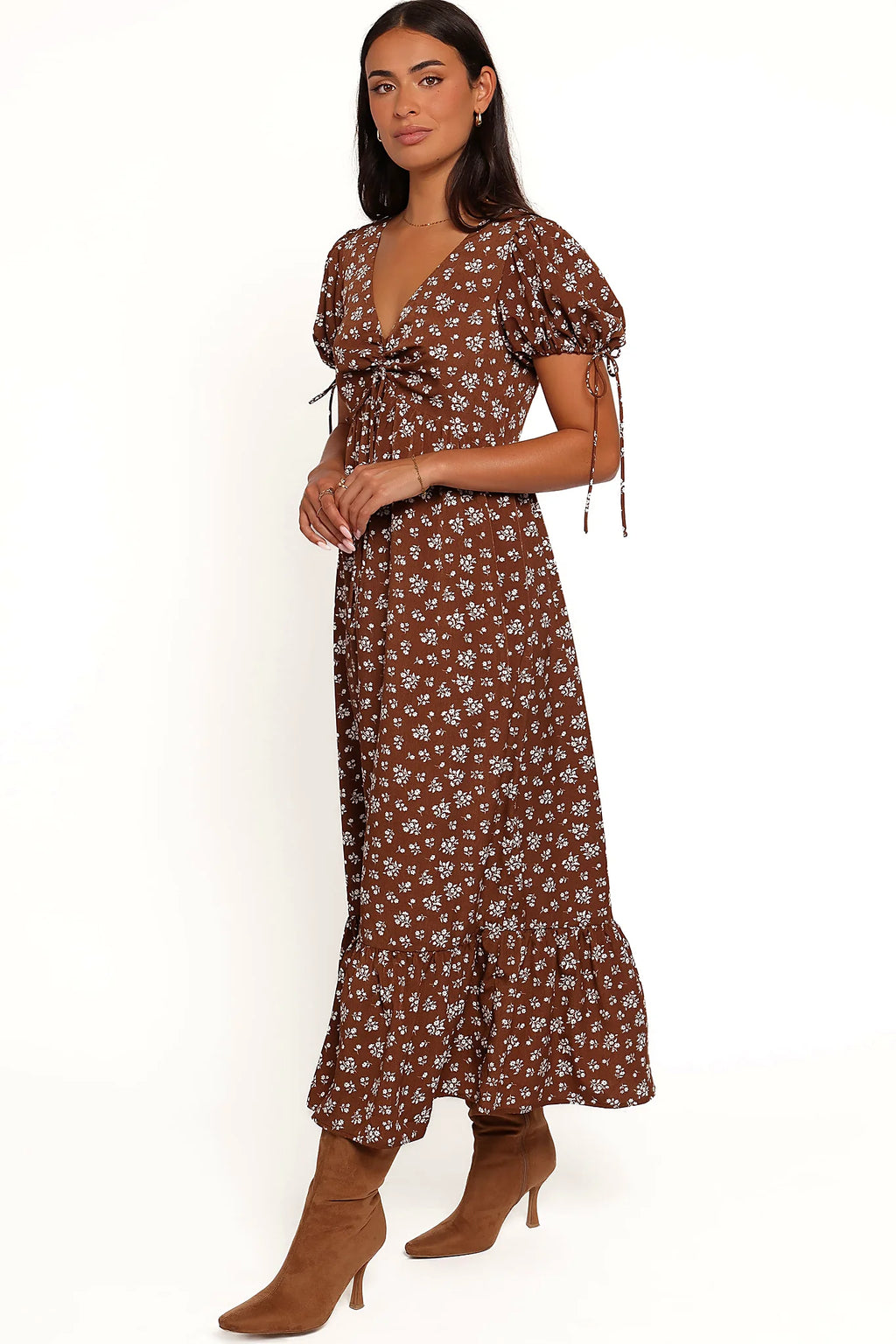 Side view of a brown ditsy floral maxi dress, showing the fit and drape of the skirt