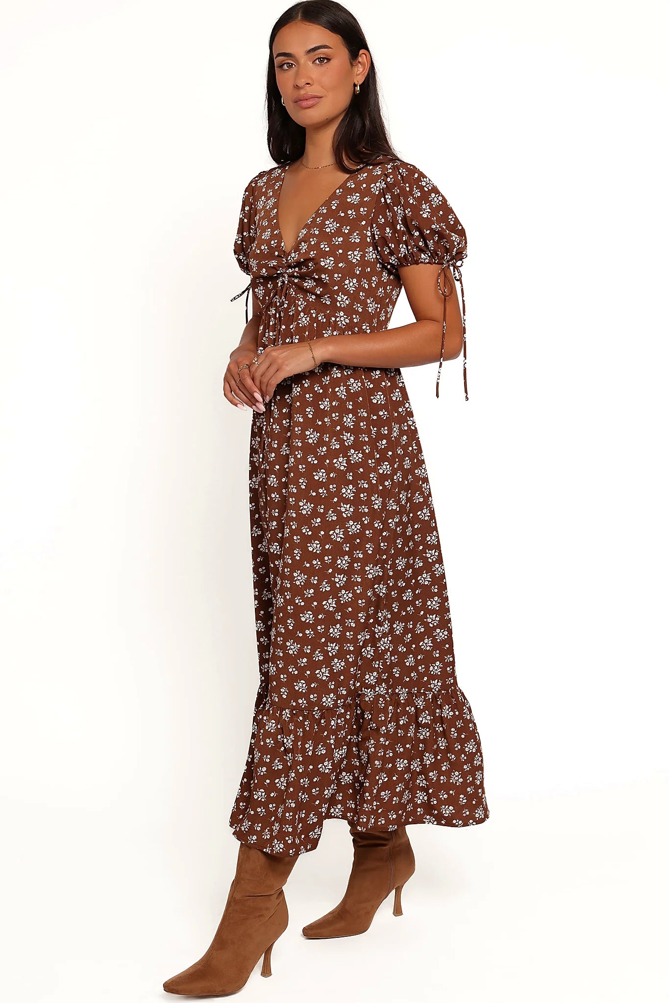 Side view of a brown ditsy floral maxi dress, showing the fit and drape of the skirt